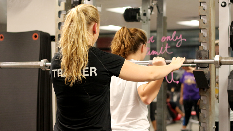 A personal trainer with a client