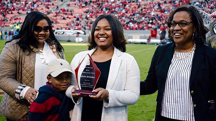 Malasia McClendon receiving the Leader of the Pack award