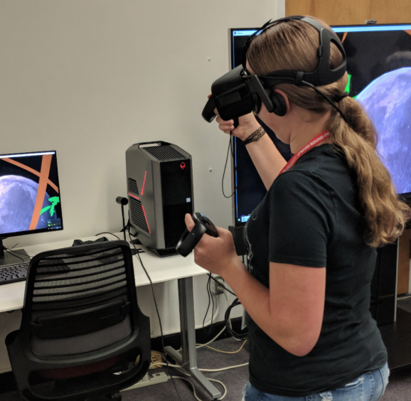UB Participants experimenting with AR/VR hardware/software in the University Library’s Virtual Reality Studio.