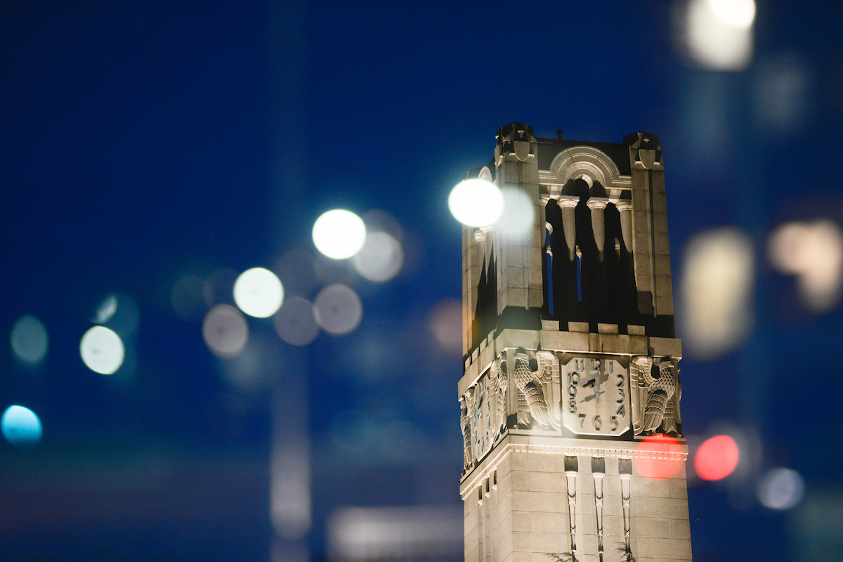 The NC State Belltower at dusk and night. Photo by Marc Hall