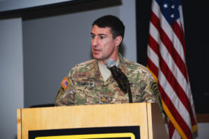 Major Blake Schwartz speaking at symposium