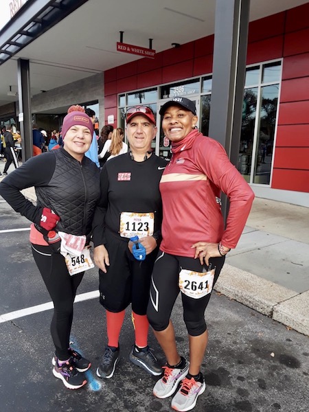 Peter Koutroumpis, Joy Kagendo, Peggy Domingue, and Renee Harrington pose together at the race.
