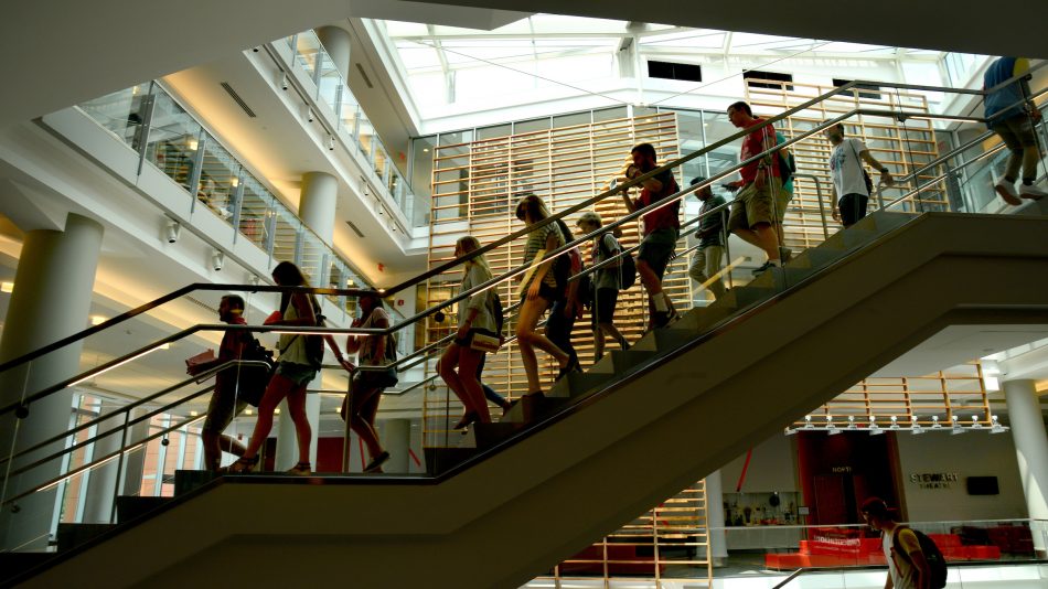Students walk down stairs in Talley Student Union during DASA orientation