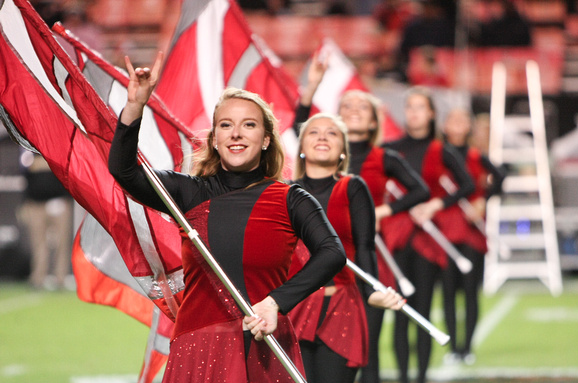 Jena Phillips performs with the color guard for the NC State marching band