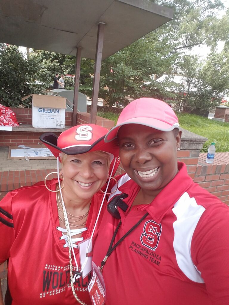 Angela Caraway poses with a fellow NC State fan and Packapalooza attendee.