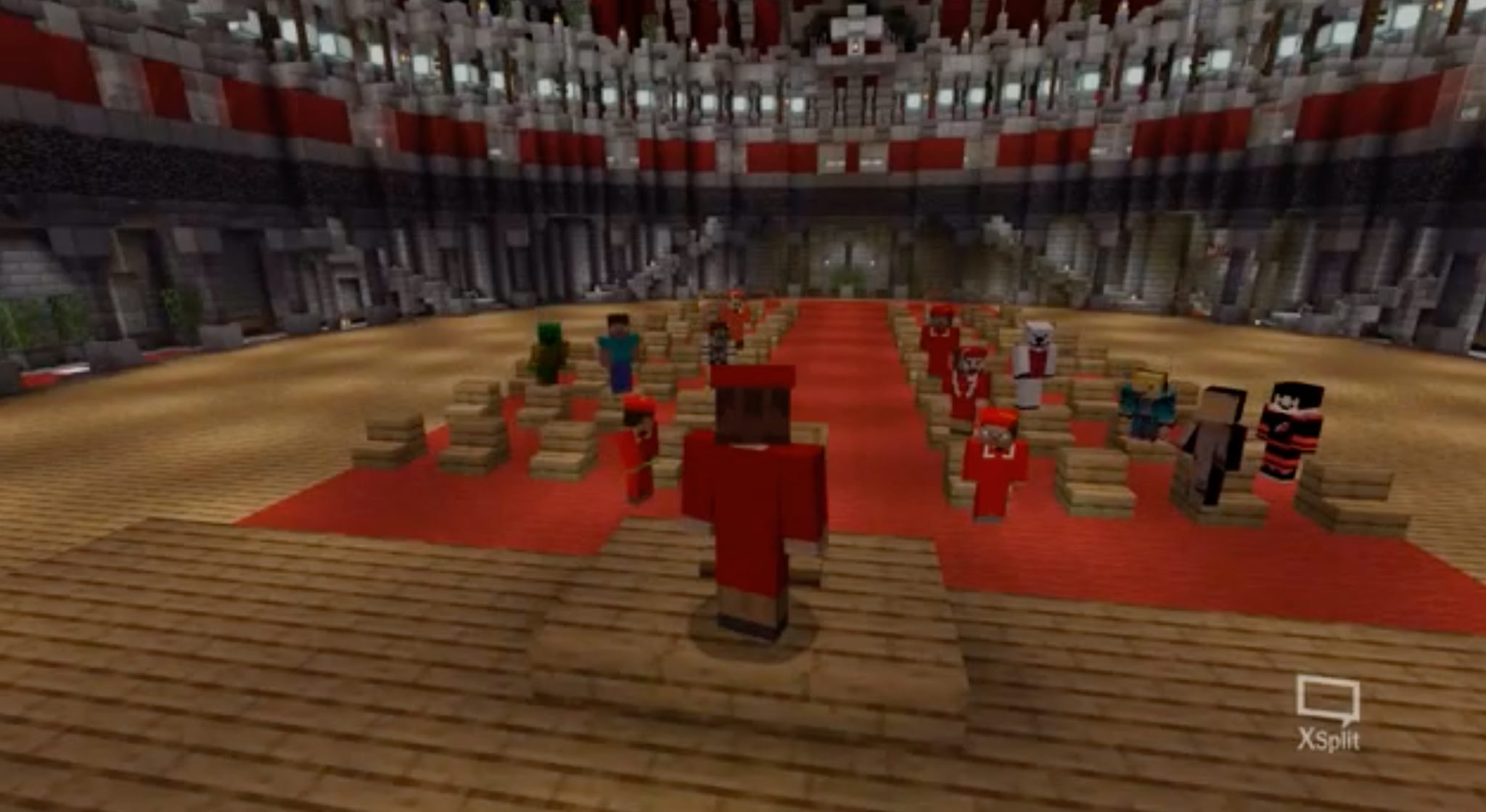 Tanner Compton's Minecraft character, dressed in red graduation robes, addresses an audience of other Minecraft players/NC State graduates in the Minecraft version of PNC Arena