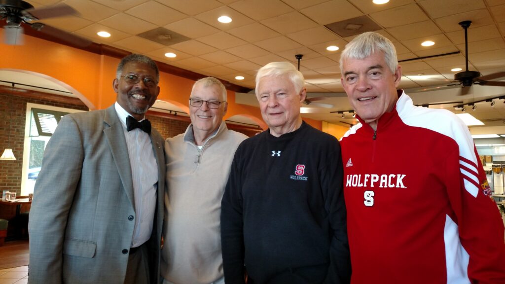 Thomas Conway pictured with other retired NC State administrators at a coffee shop in 2016