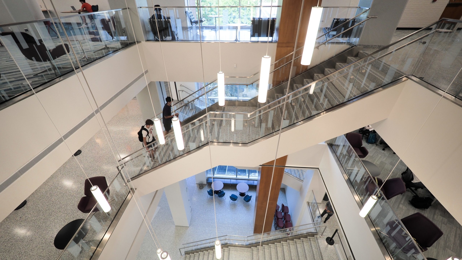 Students make their way up the central stairwell in the newly renovated D.H. Hill Library on the first day of classes, 2020.