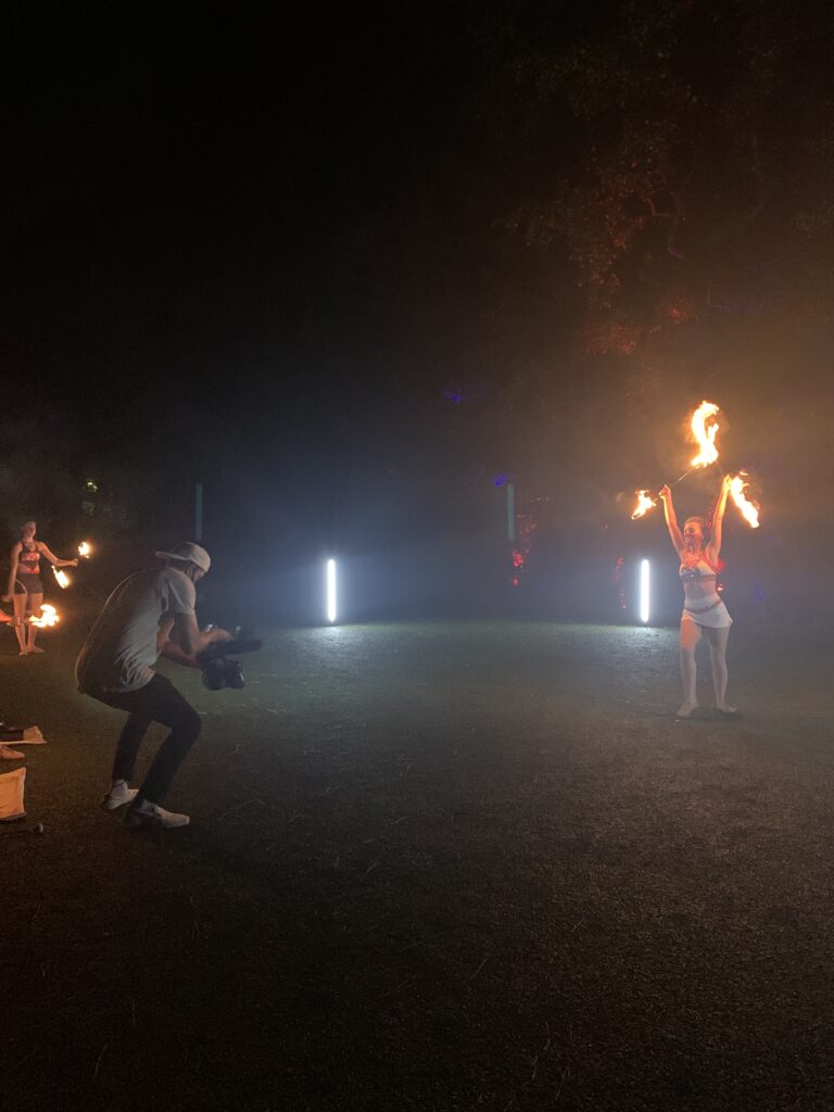 Tolar Ray films a fire twirler during the video shoot