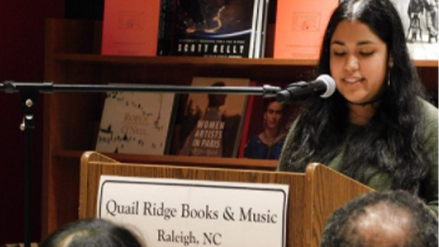 Briza Cruz gives a reading at a local bookstore