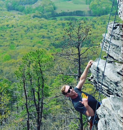 Evan Kearse rock climbing