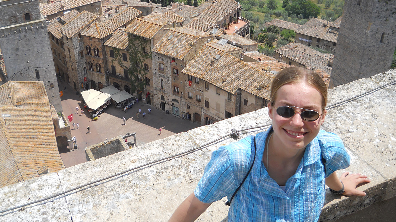 Katie Wassell on an overlook of the village of San Gimignano in Italy