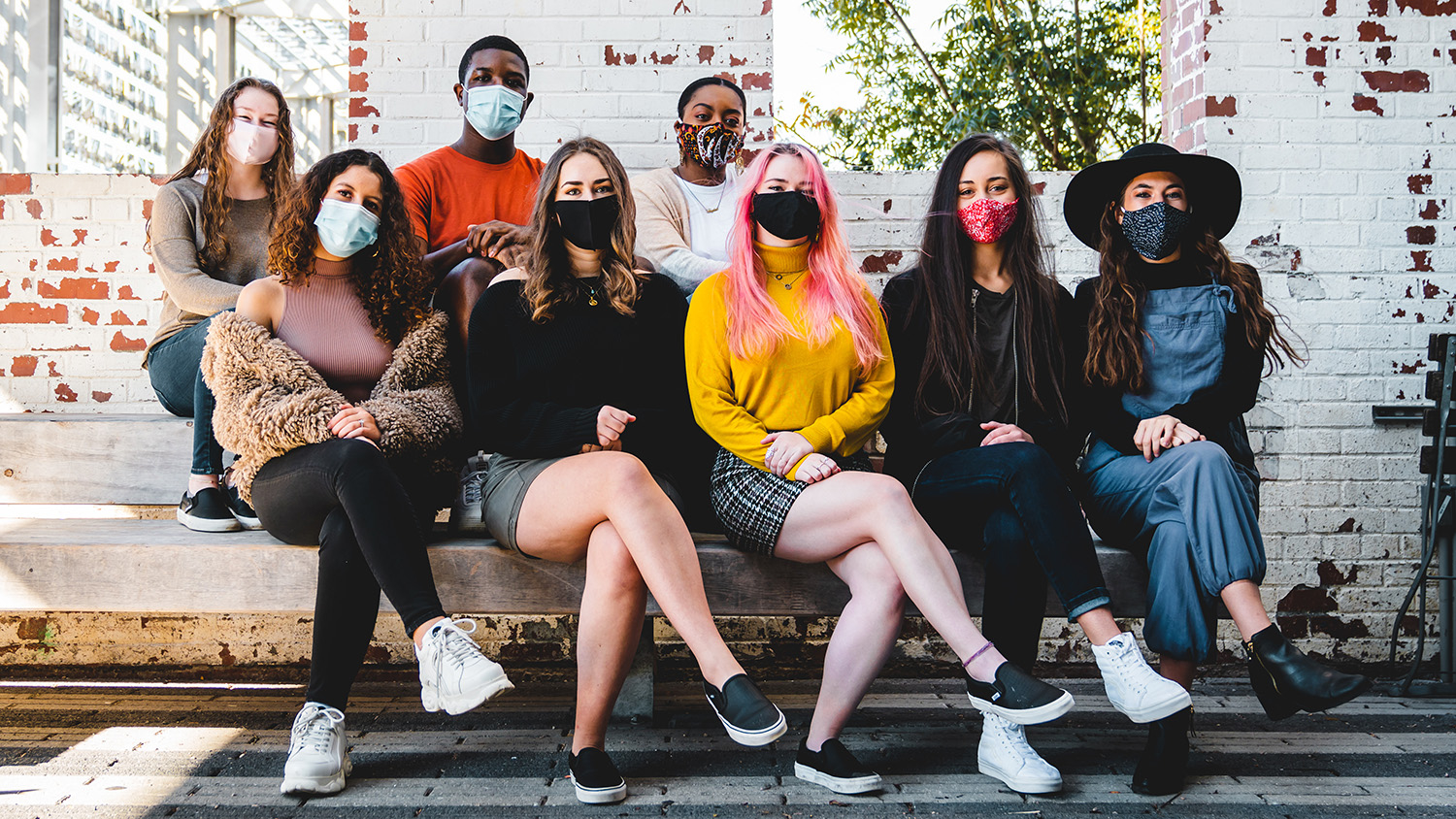 A group photo of 8 students from Fusion Dance Crew wearing protective face masks