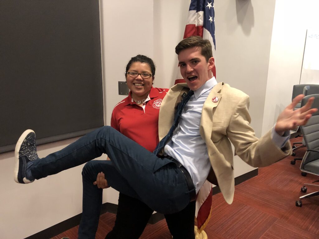 Gonzalez lifts Moravec for a funny pose after a Student Government meeting