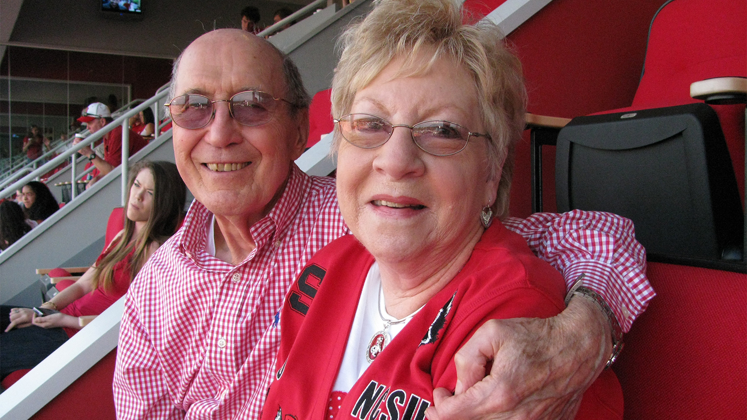 Curtis and Barbara Freeze in the stands at an NC State football game