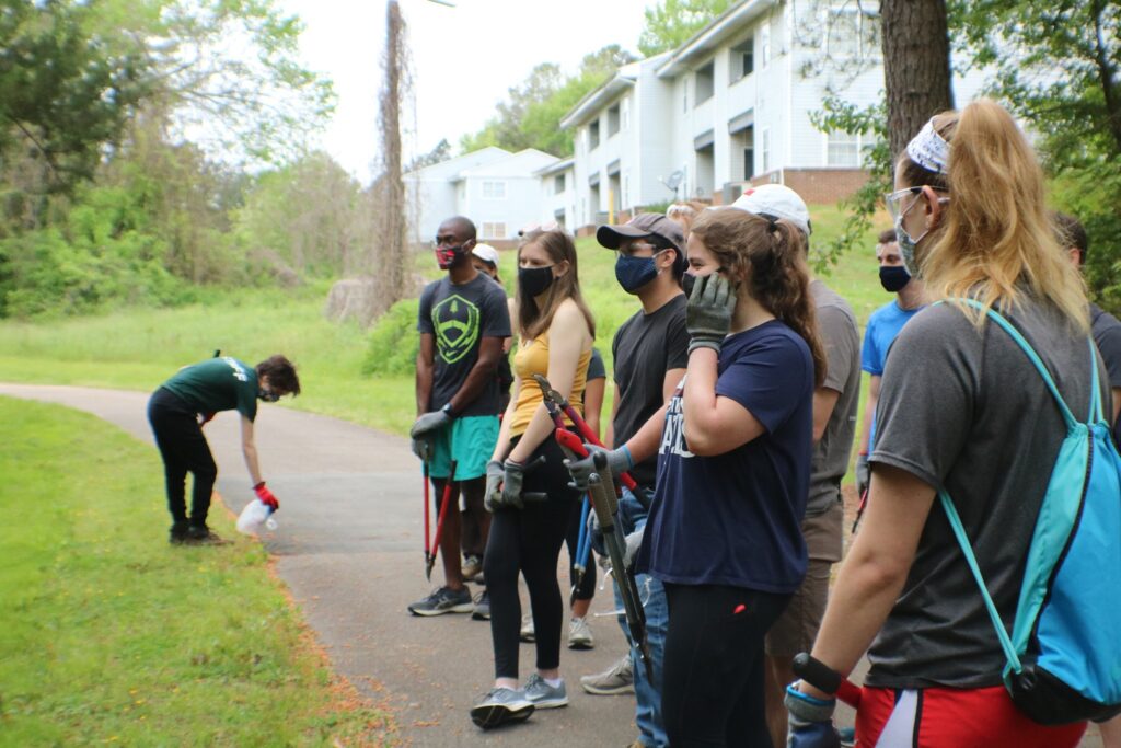 Students preparing to clean up a greenway in Raleigh as part of a Mystery Service Saturday trip