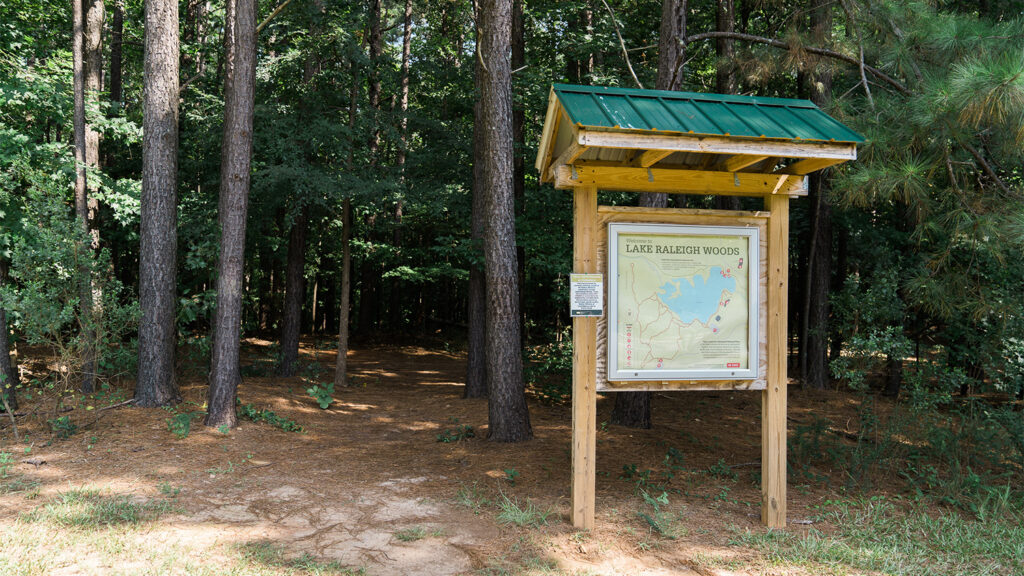 A sign at the trail head for Lake Raleigh Woods, next to the middle school on Centennial Campus