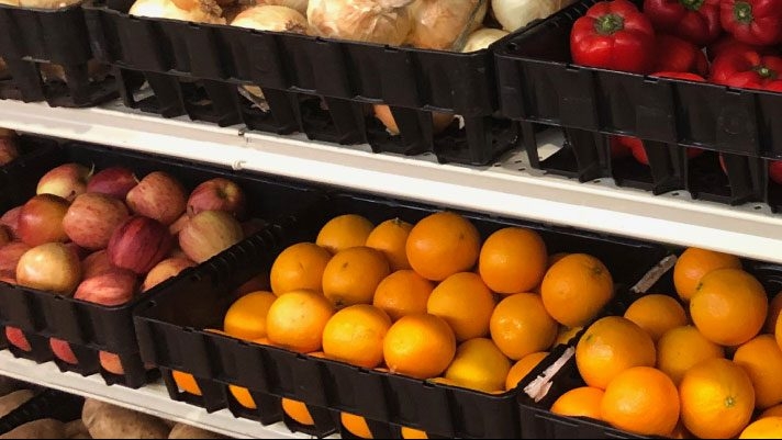 fresh fruits and vegetables on pantry shelves