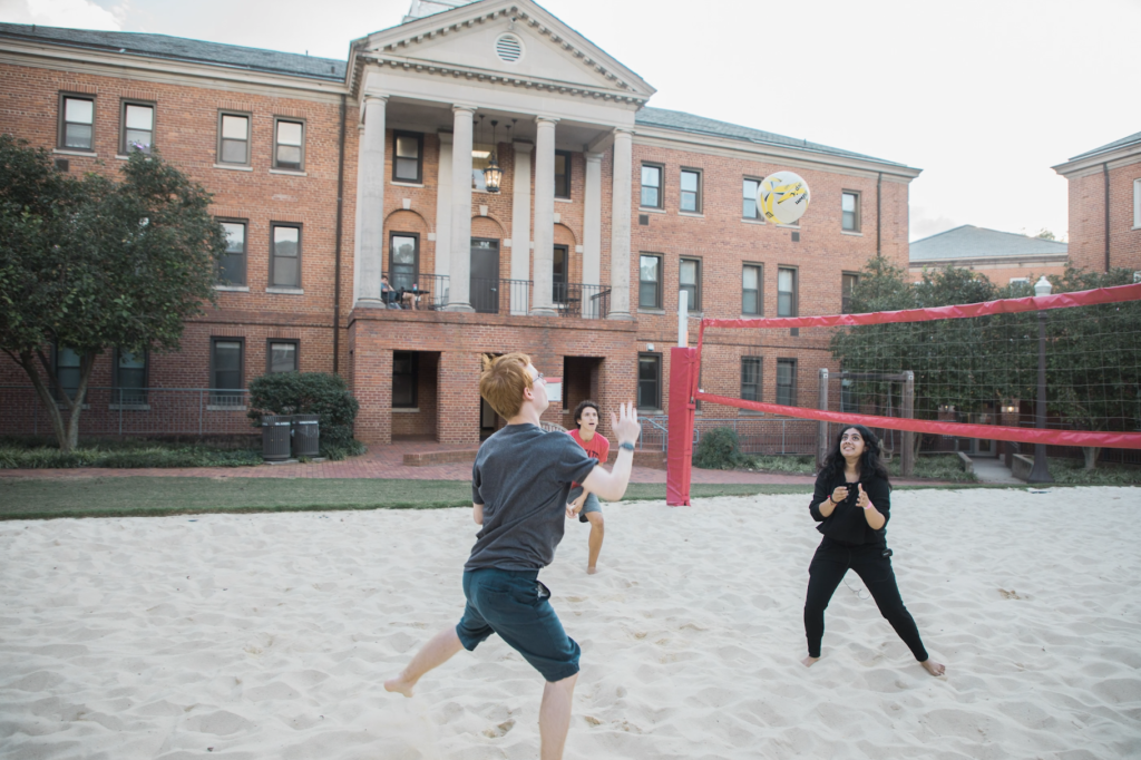 Eli Edds and his neighbors play beach volleyball on the Quad