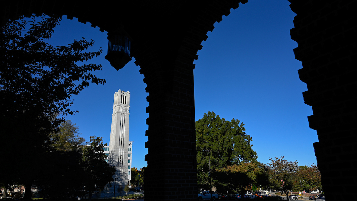 Looking towards the Memorial Bell Tower from under the front awning of Holladay Hall