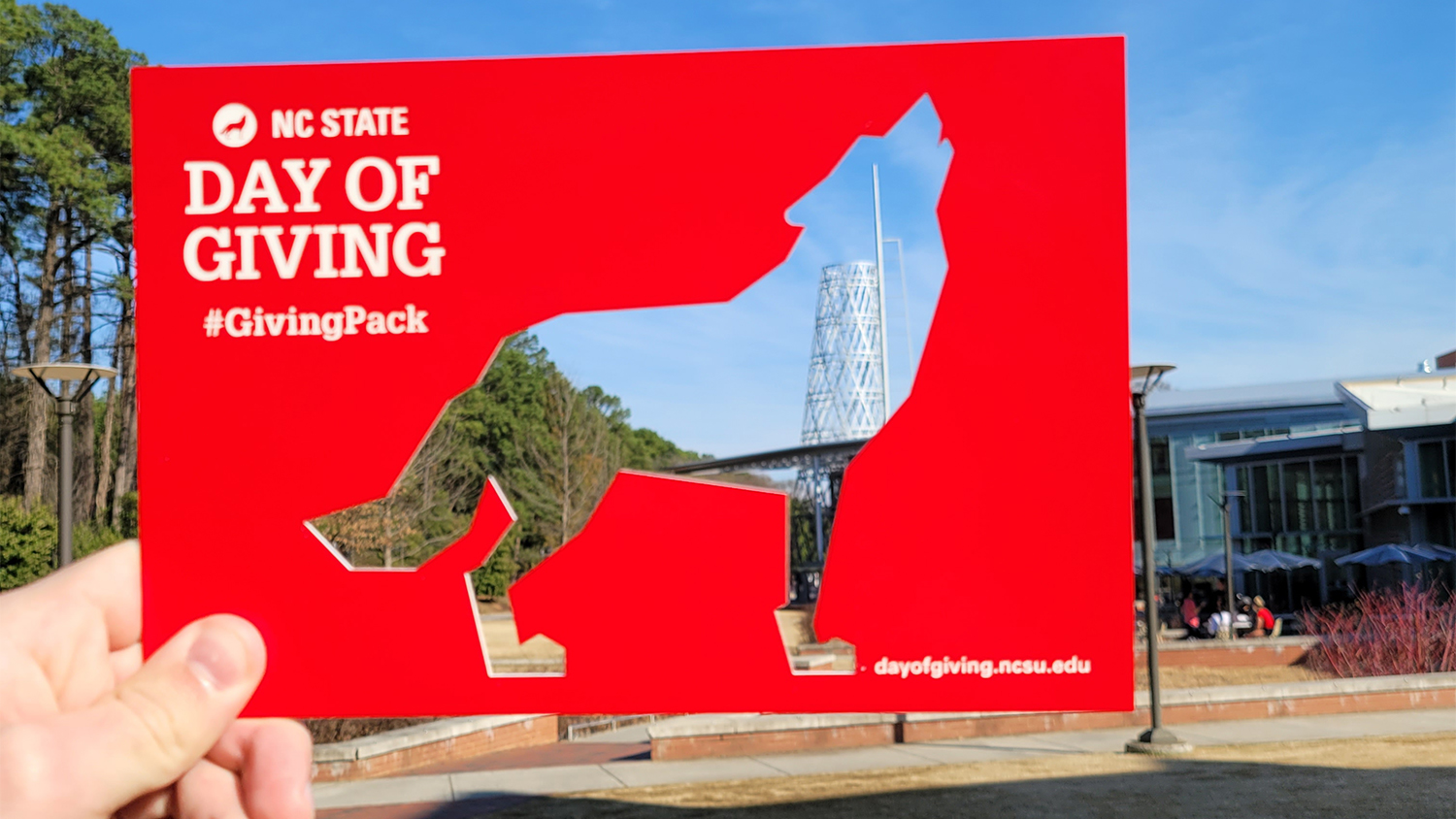 Red cutout in the shape of a wolf in front of Talley Student Union