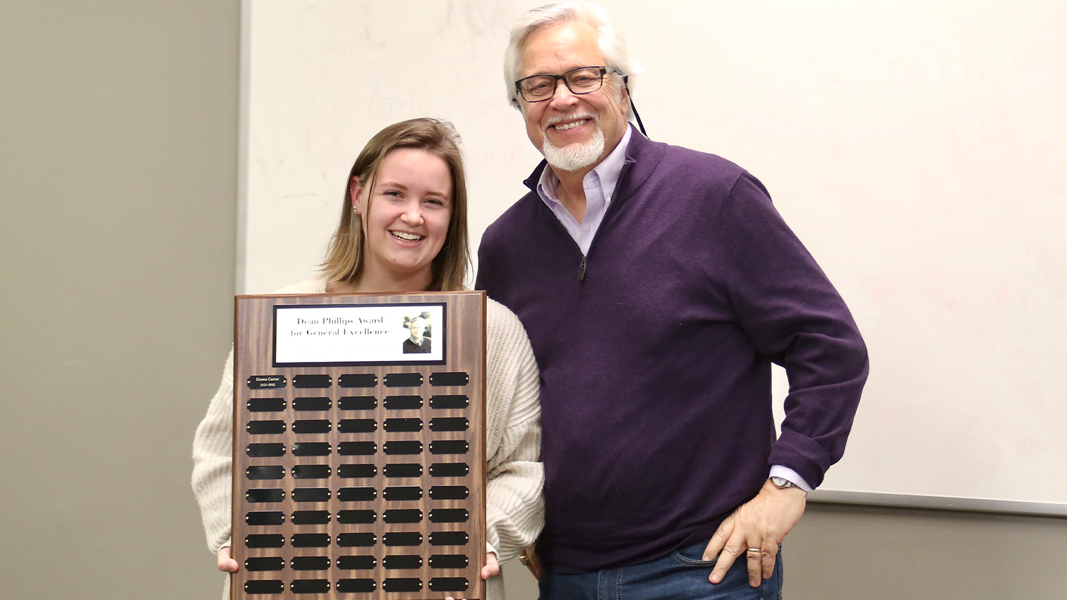 Emma Carter receives the Phillips Award from Dean Phillips, the namesake of the award