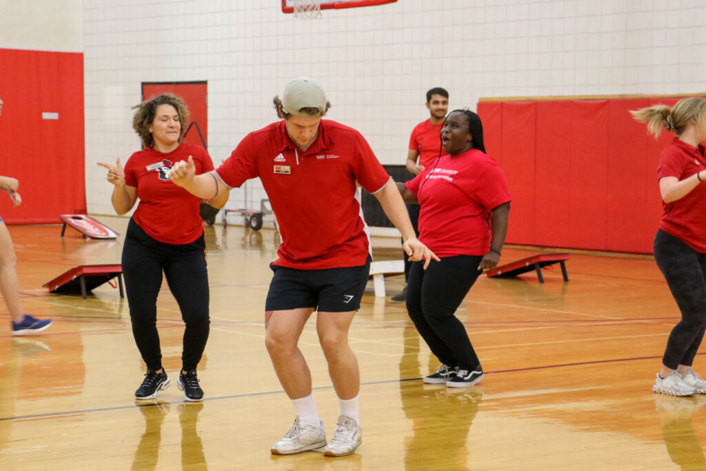 Zack and his colleagues dance to the Cupid Shuffle during WellRec's Howl and Chill event in April