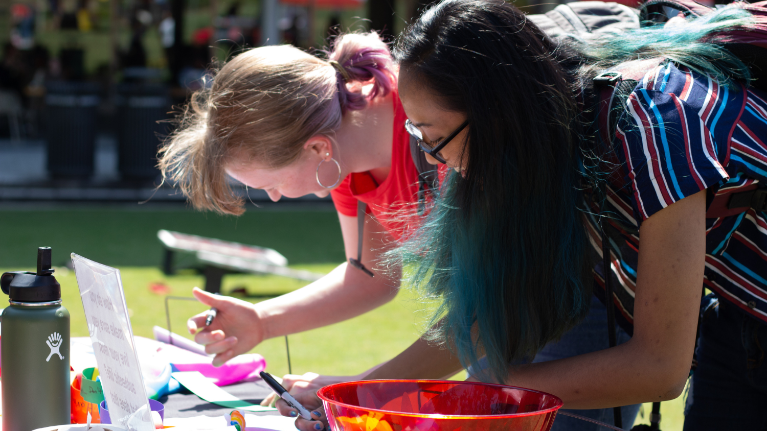 Two students participating in an activity at Fresh Check Day.