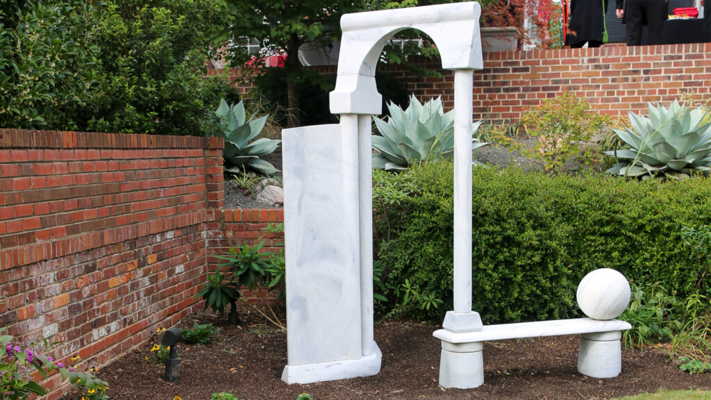 The marble artwork called Italian Reflections in the garden outside the Gregg Museum