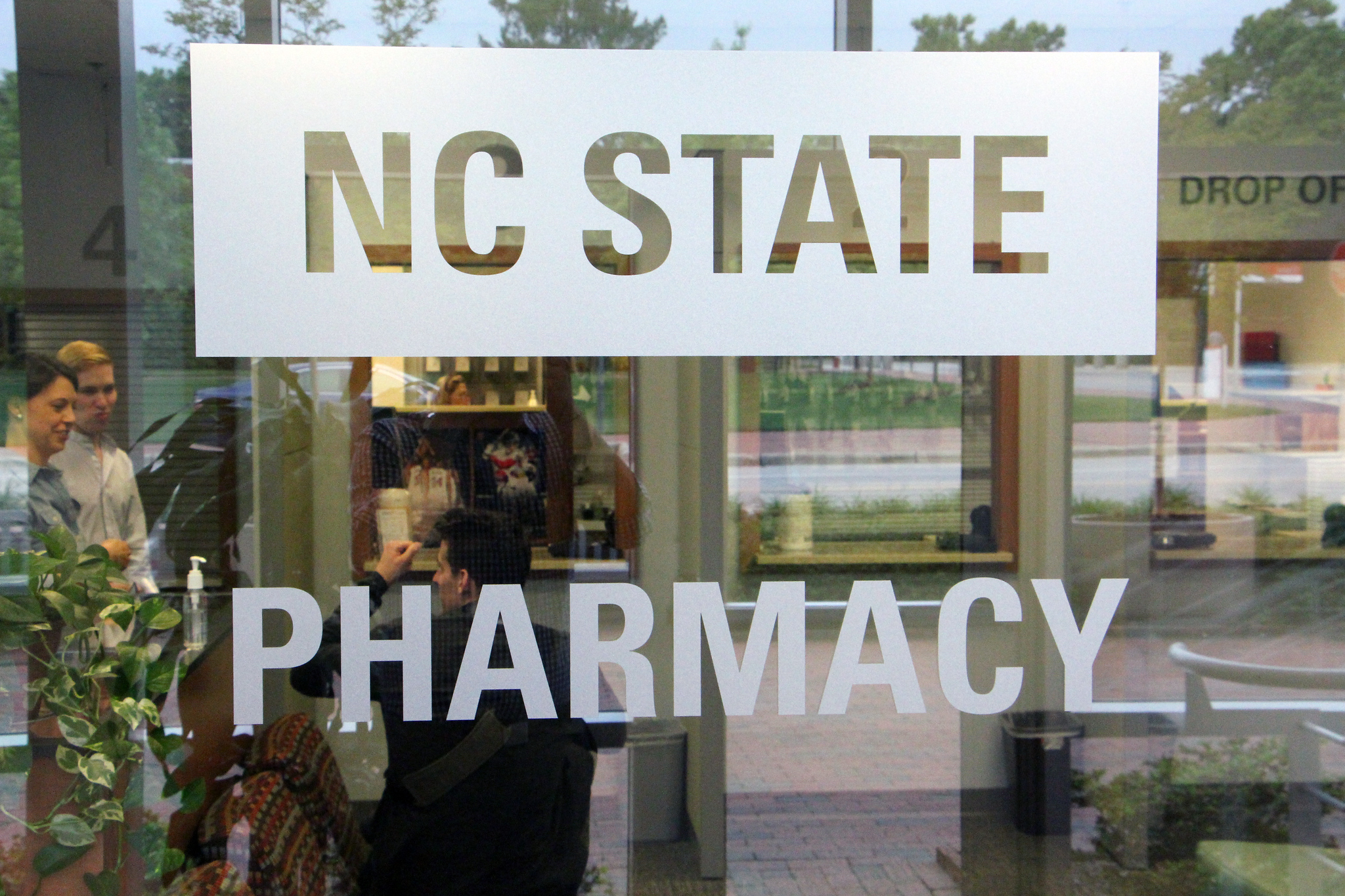 A sign for the NC State Pharmacy