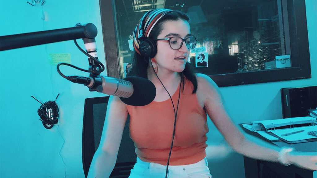 Caitlin in the recording studio as a DJ