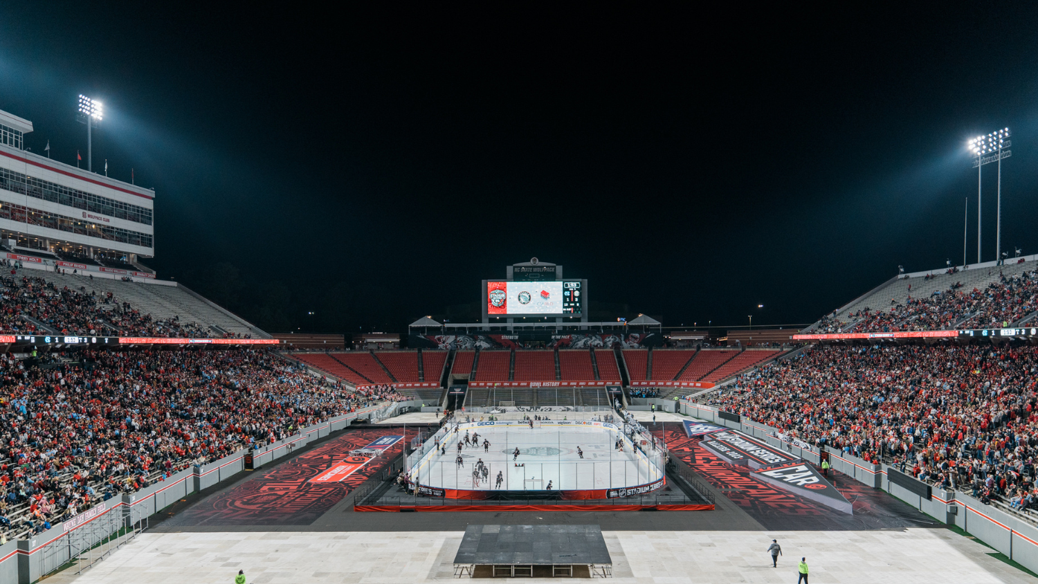 wide shot of the hockey game at Carter-Finley Arena