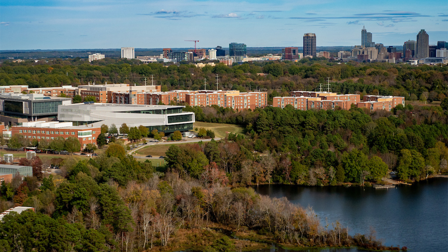 Aerial view of Centennial campus with downtown Raleigh in the background