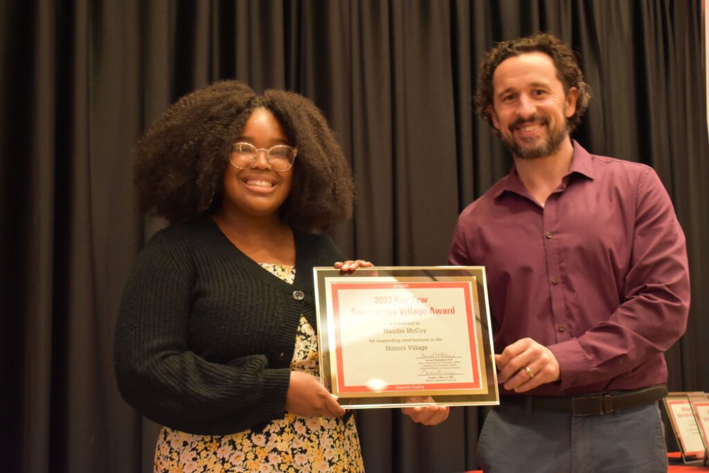 Naudia McKoy receives the Spirit of the Village Award from Village Director Scott O'Leary