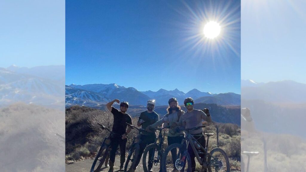 Taylor '12 with friends mountain biking.