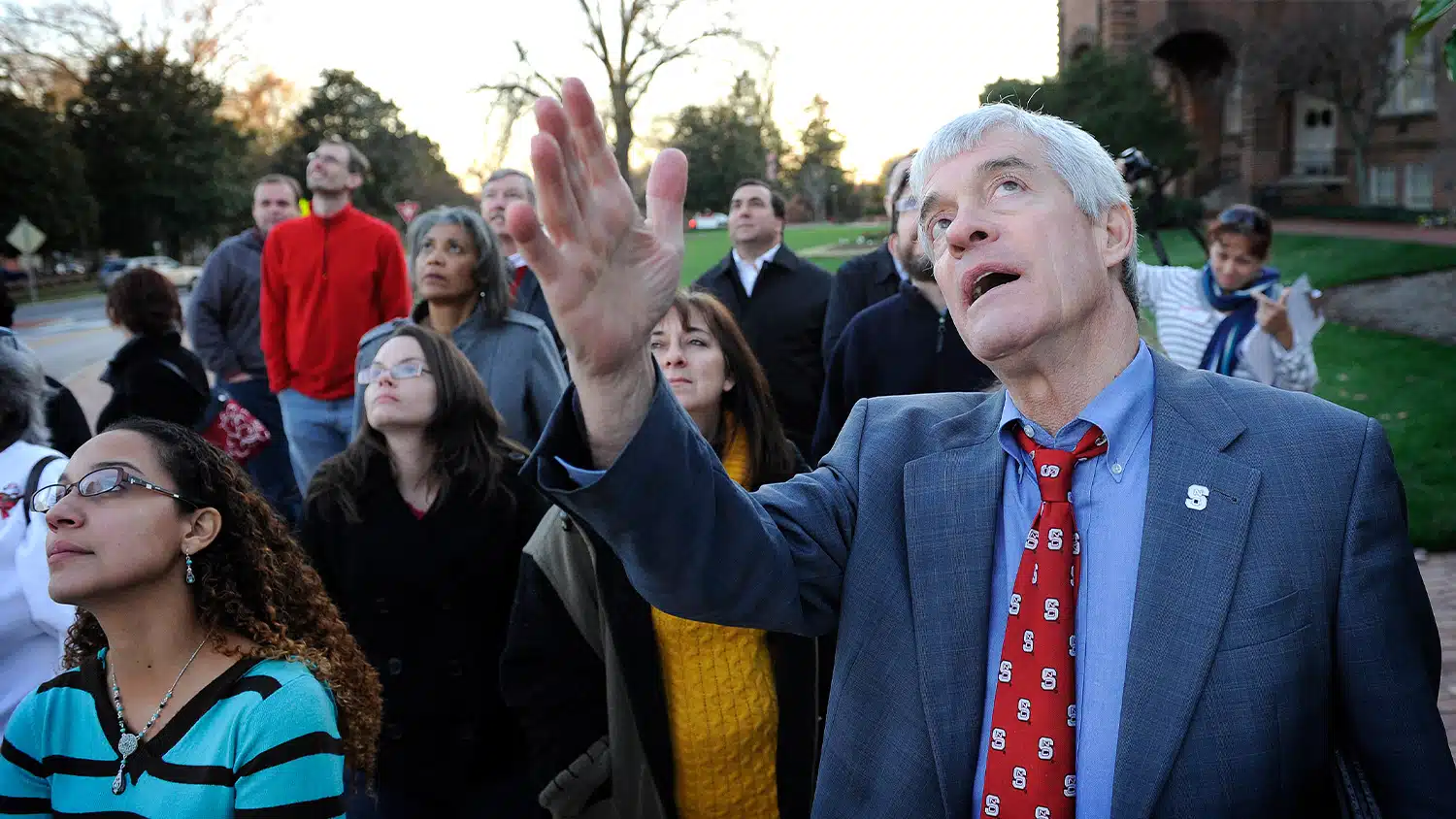 Tom Stafford, vice chancellor for student affairs emeritus, gives a tour of NC State’s Memorial Belltower.