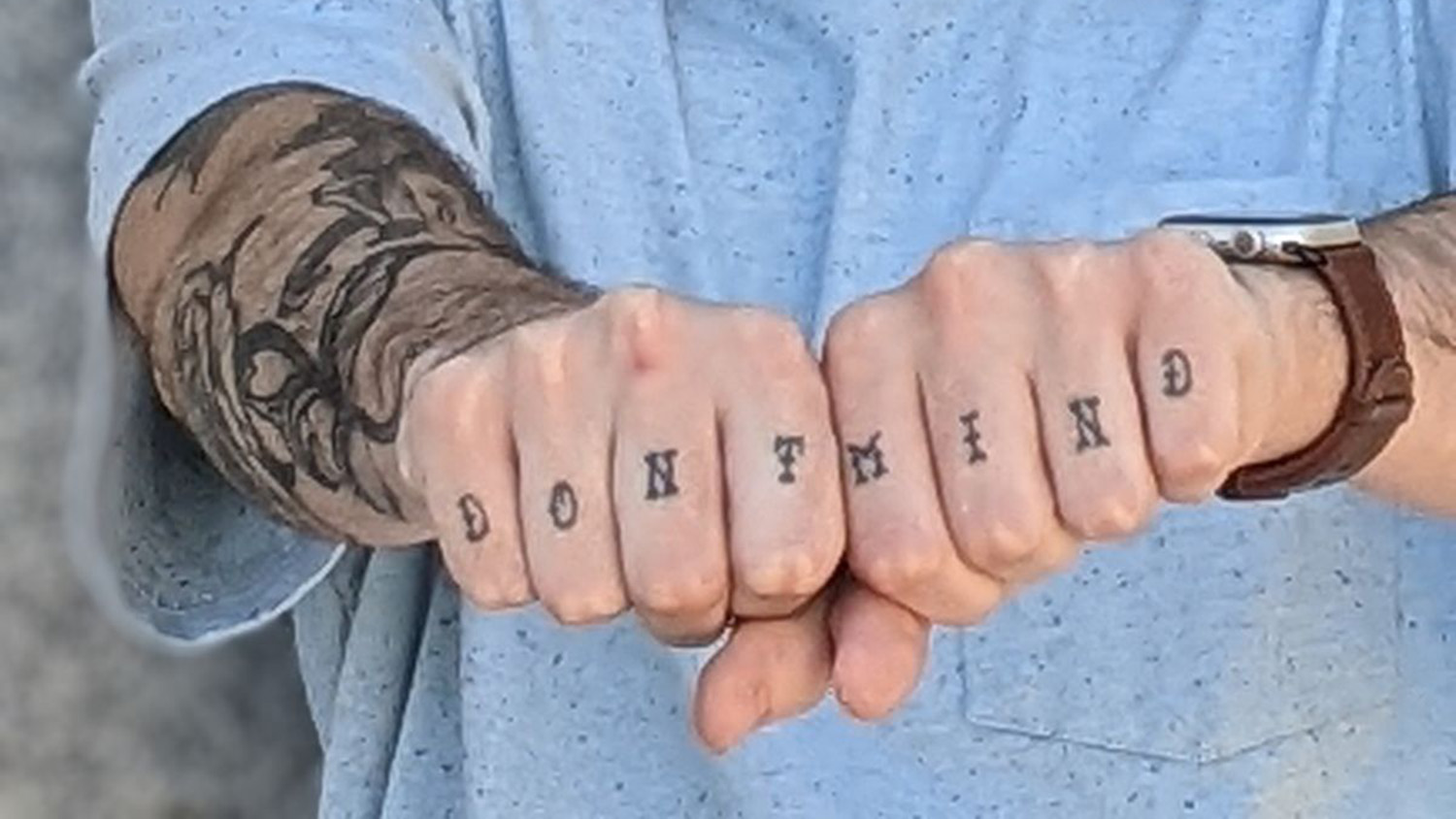NC State alum Dylan Ebbs has tattoos on the fingers of each of his knuckles that spell out "don't mind," symbolizing his willingness to talk about his mental health journey.