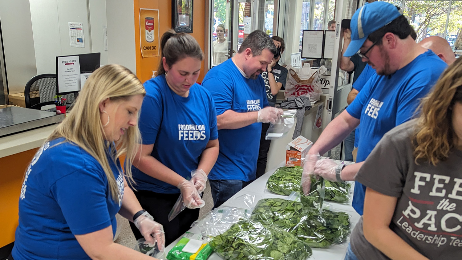 Food Lion Feeds staff packages spinach for the Feed the Pack Food Pantry. 