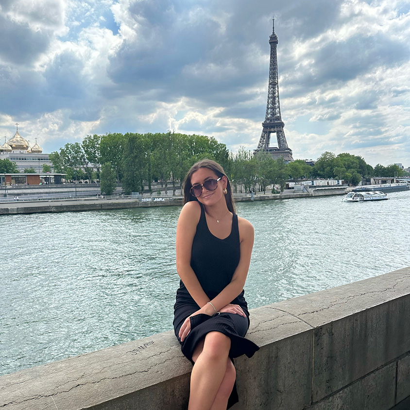 University Honors Program student Sara Danowitz in front of the Eiffel Tower. 