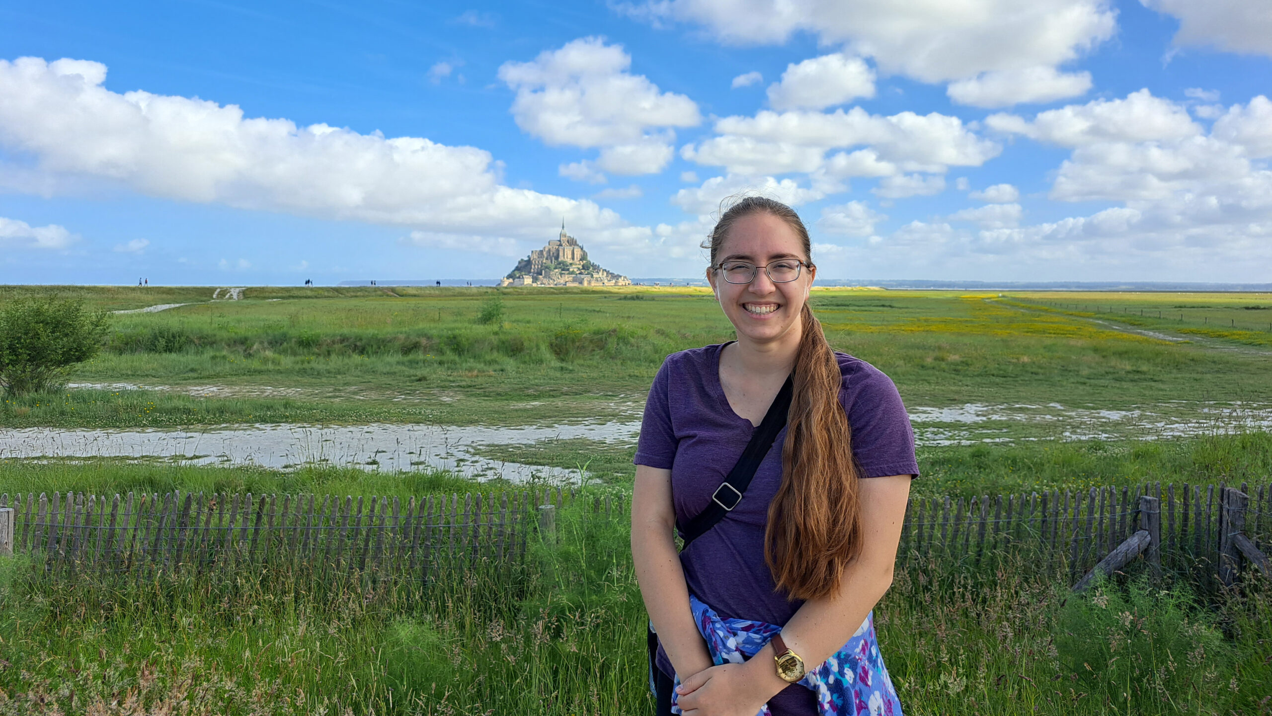 ASC's Rosie Maloney in front of a marsh and castle.
