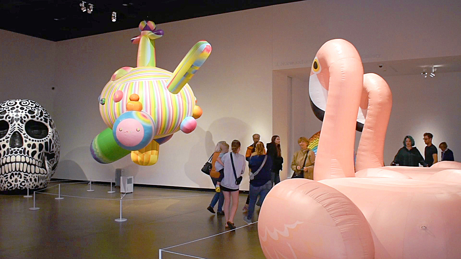 A group of visitors looks at BLOW UP II: Inflatable Contemporary Art at the Gregg Museum of Art & Design near the closing of the exhibition.