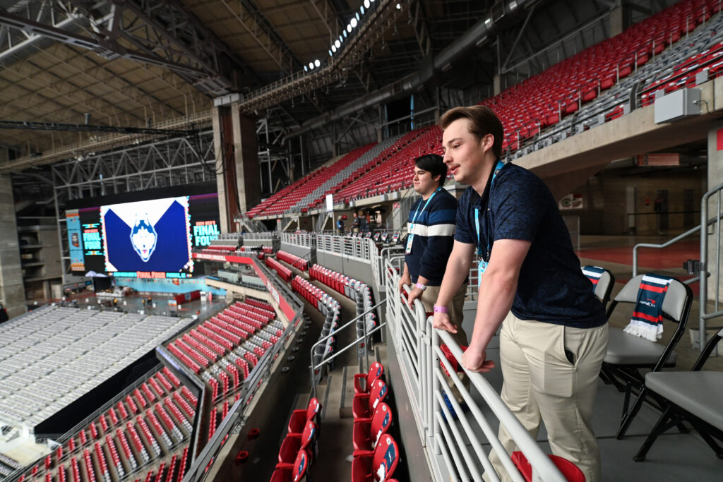 Technician Assistant Sports Editor Noah Teague, left, and Sports Editor Colby Trotter take in the view at State Farm Stadium in Phoenix. 