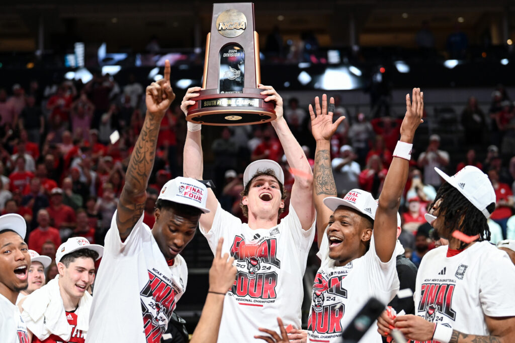 In a photo captured by Technician Senior Staff Photographer Hallie Walker, the NC State men's basketball team celebrates after beating Duke to advance to the NCAA Final Four. 