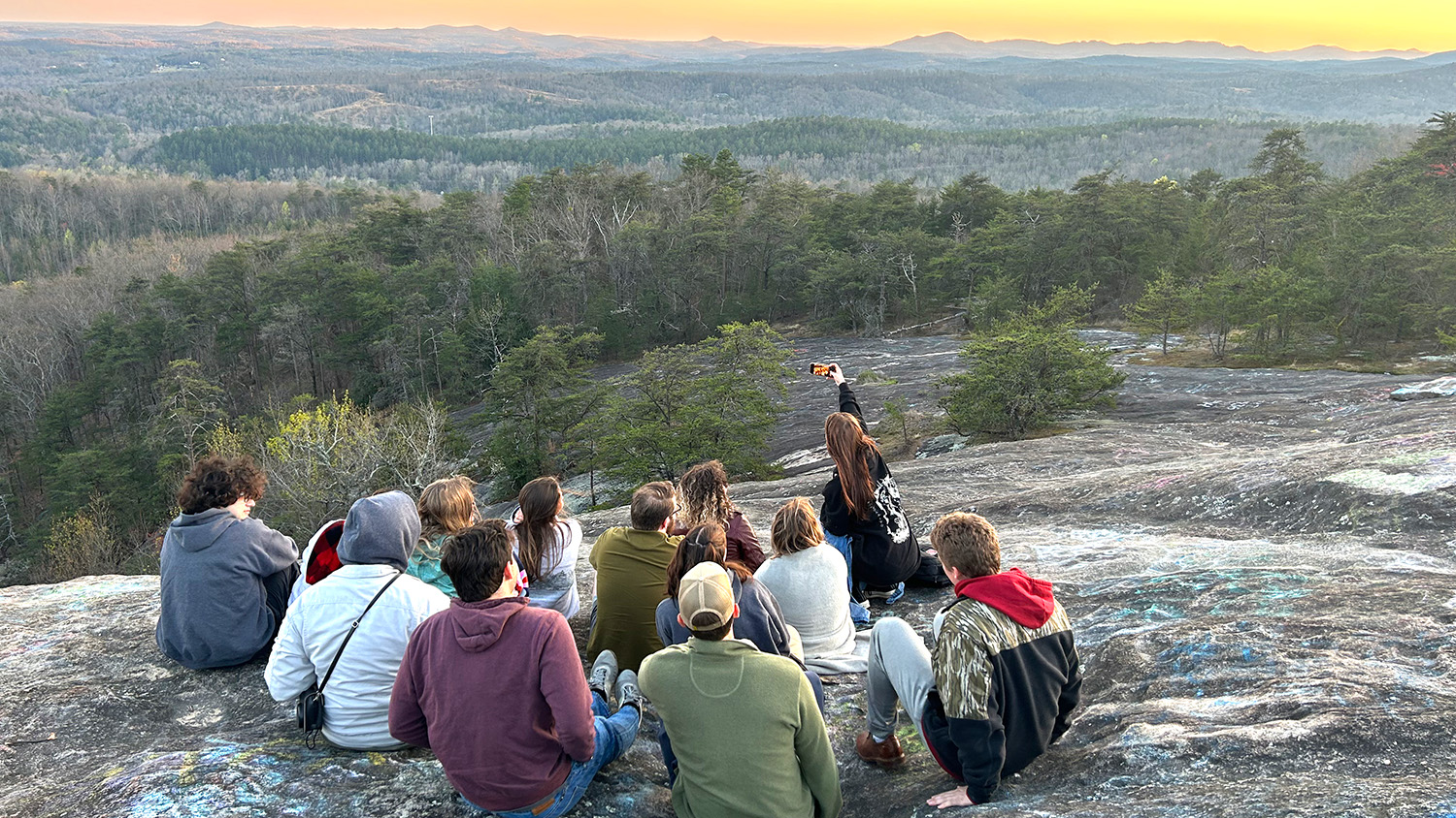 Students in NC State's Collegiate Recovery Community take in a mountain view on an overnight retreat.