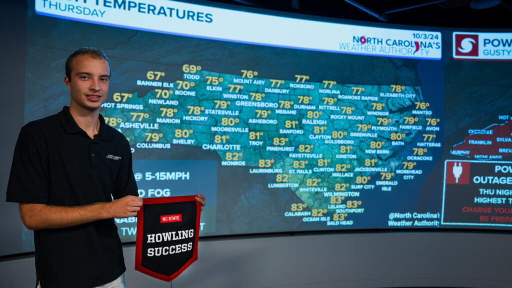 Ethan Clark shows his daily forecast map. 