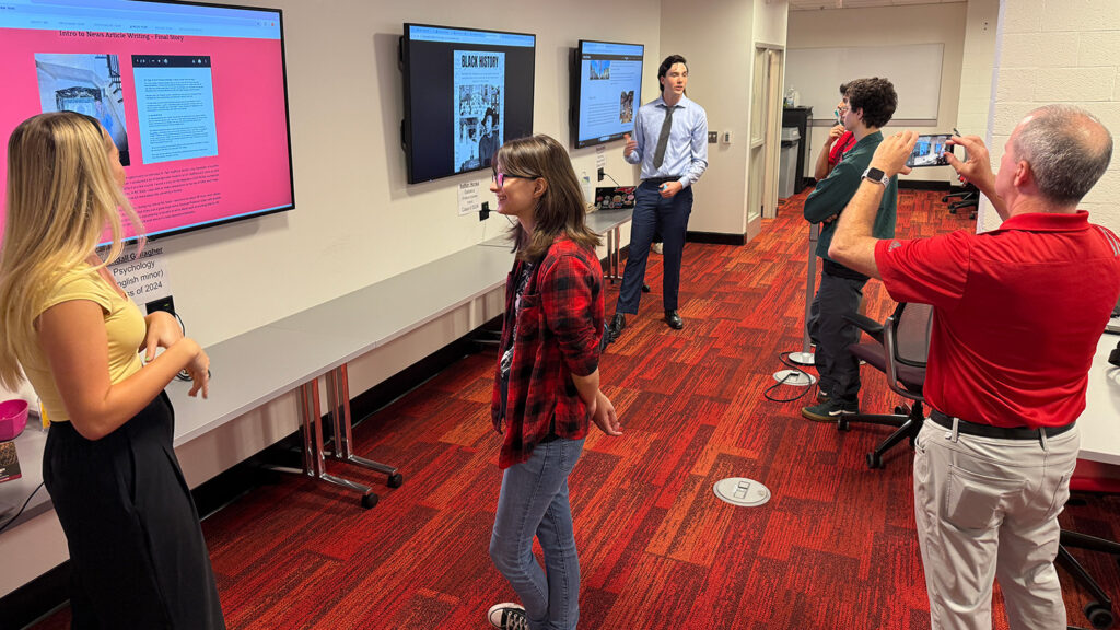 December 2024 UHP graduates, Kendall Gallagher and Nathan Honea, presenting their senior projects during the University Honors Program Portfolio Showcase on Nov. 8.