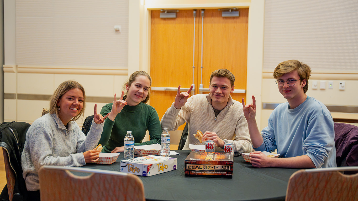 Transfer Students throw up their "wolfies" at TransferPack Winter Welcome, a signature Winter Welcome Week event at NC State.