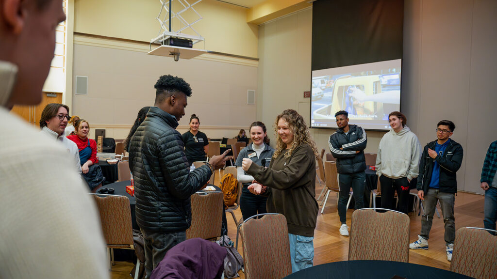 Students enjoy a game of rock, paper, scissors at TransferPack Winter Welcome. 