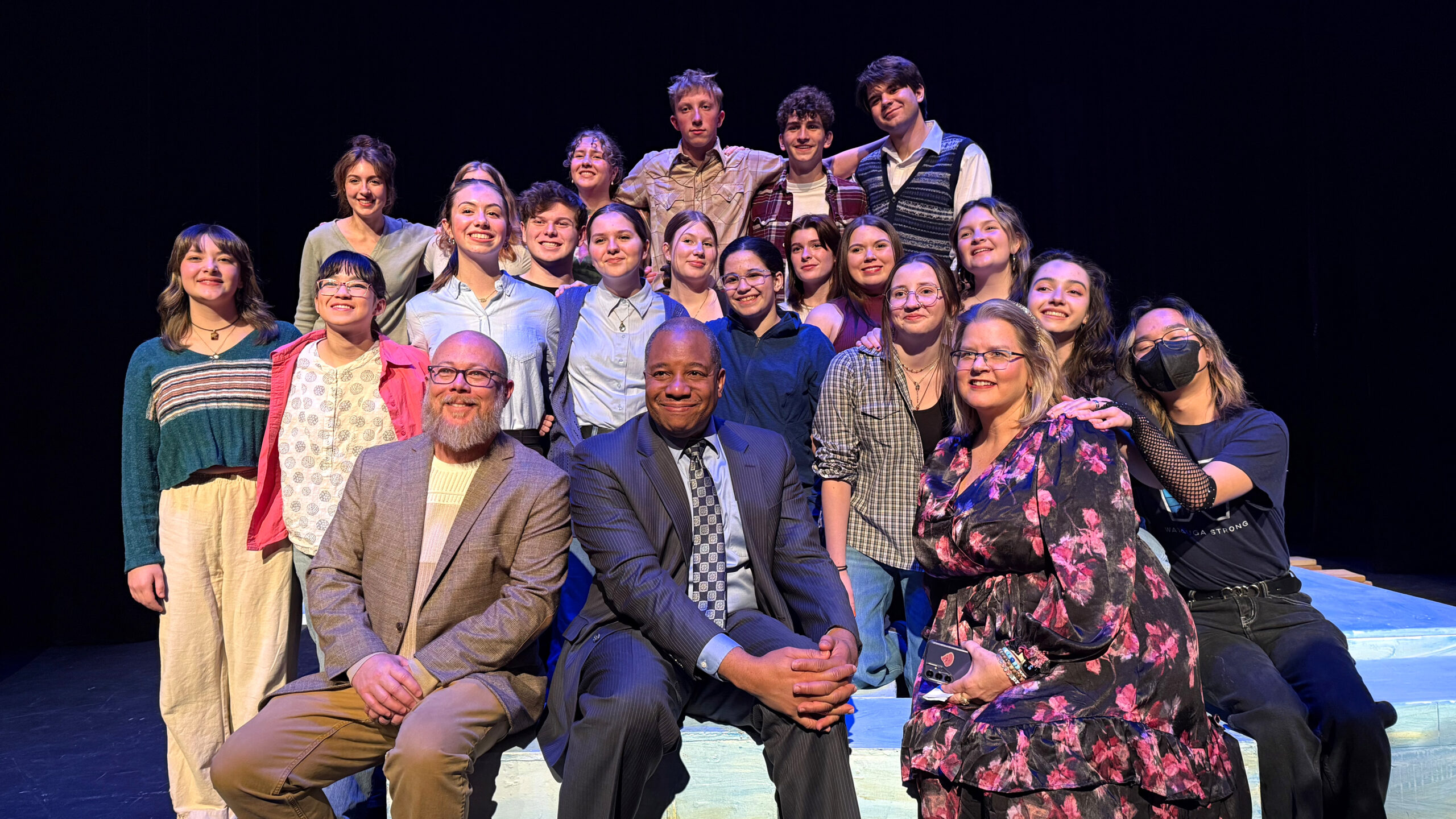 The student cast of SURGE, a play telling the story of Hurricane Helene's impact in Watauga County, gather for a group photo after performing in NC State's Kennedy-McIlwee Studio Theater.