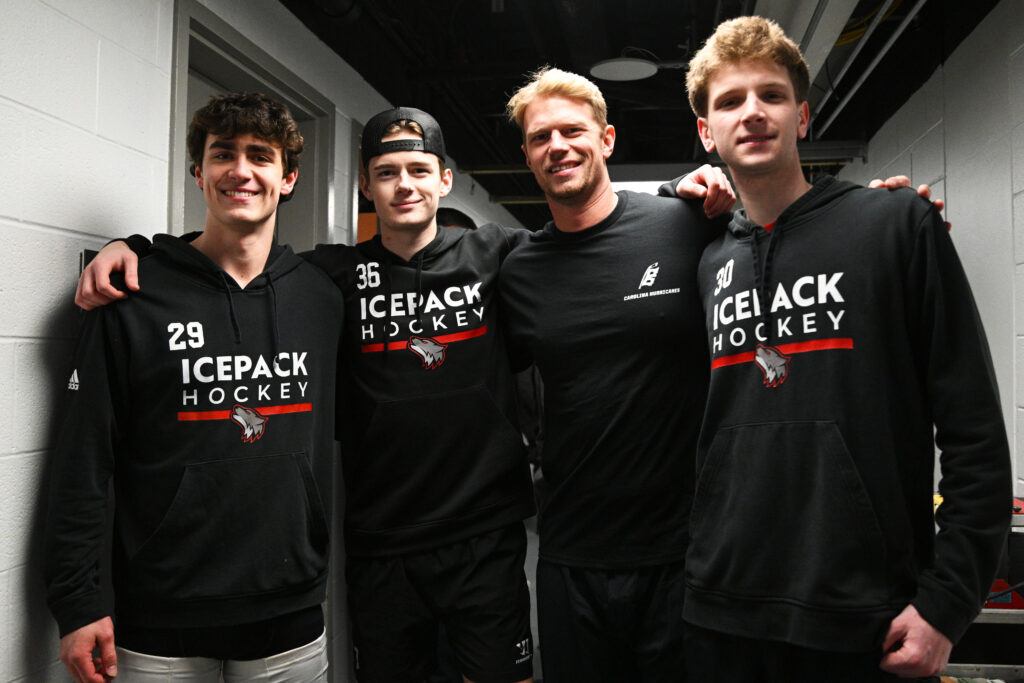 NC State Icepack players pose for a photo with Hurricanes retiree Eric Staal.
